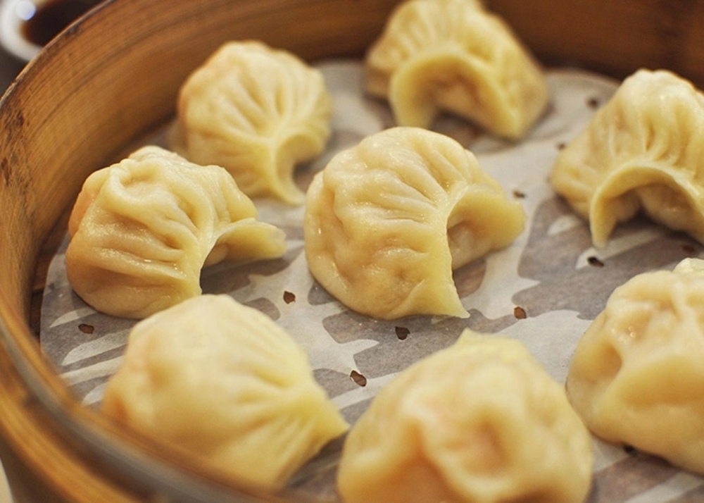 a basket of steamed dumplings